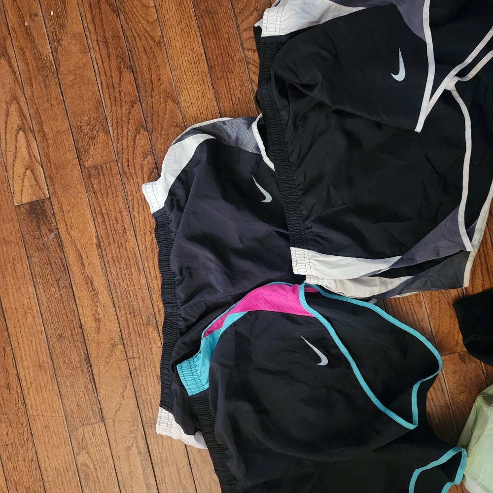 Nike Women's Black Athletic Shorts with Teal Trim and Pink Accent
